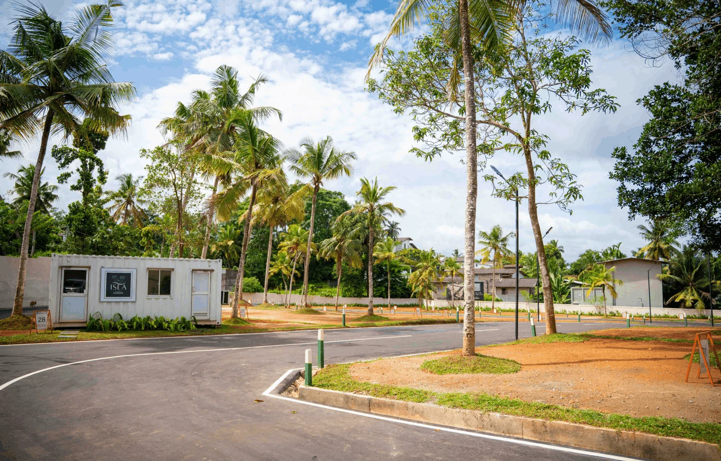 Tree-lined property entrance and open grounds